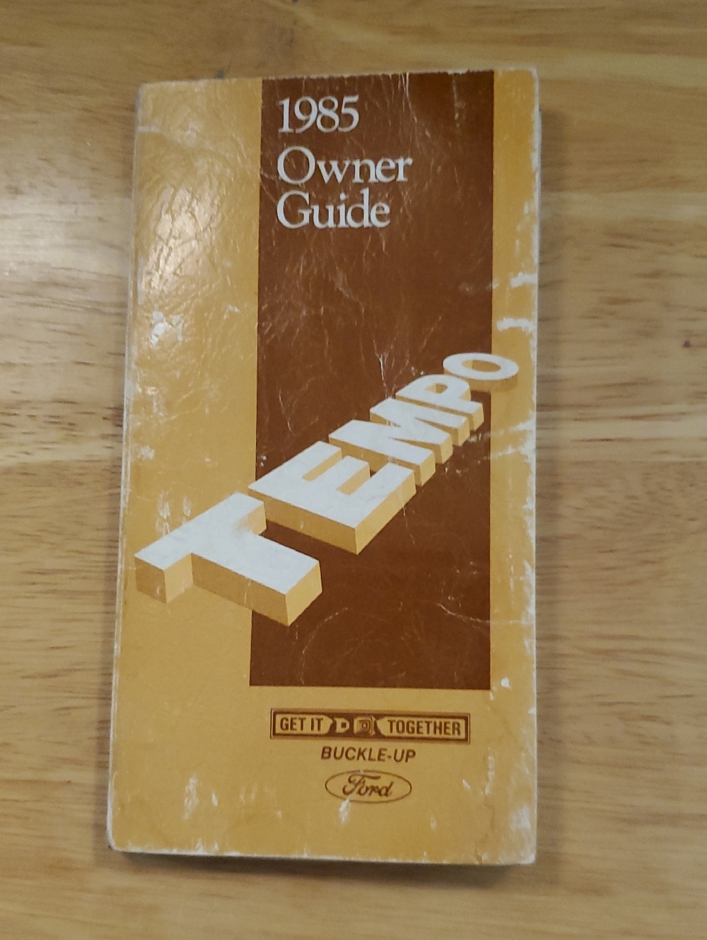 Ford yellow and brown Tempo Owner Guide booklet